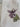 White tote bag with a purple flower design and a visible brand tag