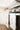 kitchen stove with white linen decorative tea towel featuring penguin