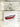 fine art print with red canoe and paddle