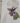 White tote bag with a purple flower design and a visible brand tag 