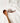 White apron with a snail design and wooden spoon on a light background