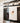 tea towel with gold hummingbird art on stove