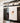 tea towel with gold hummingbird art on stove