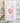 large pink peony blossom on white linen dish towel